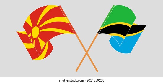 Banderas cruzadas y ondeando banderas del norte de Macedonia y Tanzania