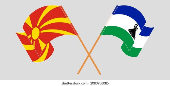 Crossed and waving flags of North Macedonia and Kingdom of Lesotho. Vector illustration
