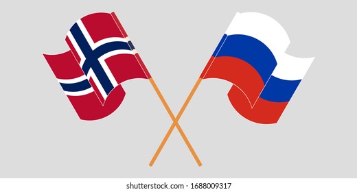 Crossed and waving flags of Norway and Russia