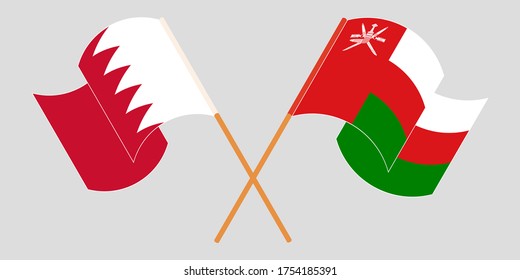 Crossed and waving flags of Oman and Bahrain. Vector illustration