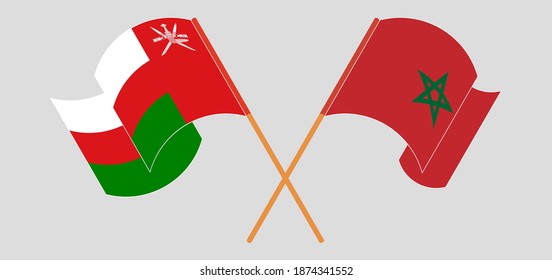 Banderas cruzadas y ondeando banderas de Omán y Marruecos