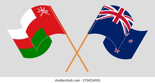 Crossed and waving flags of Oman and New Zealand