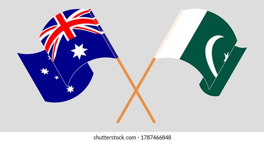 Crossed and waving flags of Pakistan and Australia