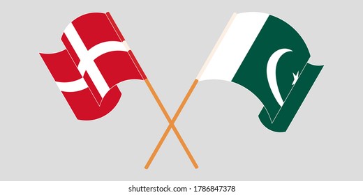 Cruzando y ondeando banderas de Pakistán y Dinamarca