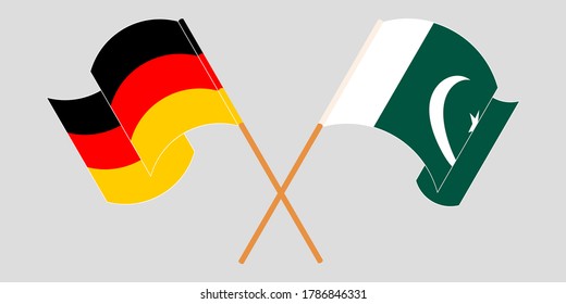 Crossed and waving flags of Pakistan and Germany