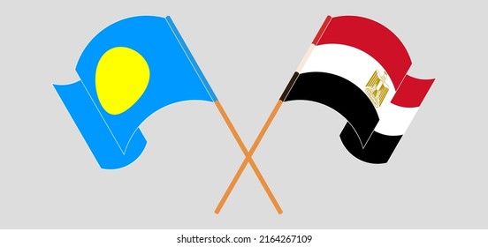 Crossed and waving flags of Palau and Egypt. Vector illustration
