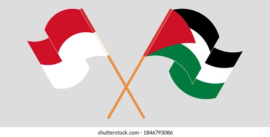 Crossed and waving flags of Palestine and Indonesia