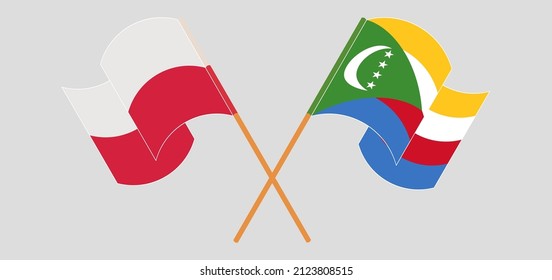 Crossed and waving flags of Poland and Comoros. Vector illustration
