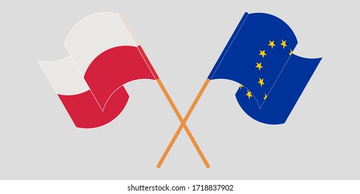Gekreuzte und wehende Flaggen von Polen und der EU