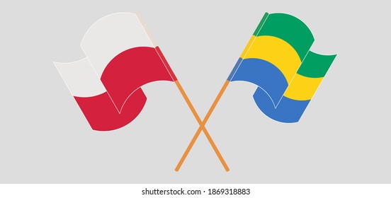 Crossed and waving flags of Poland and Gabon