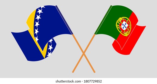 Crossed and waving flags of Portugal and Bosnia and Herzegovina