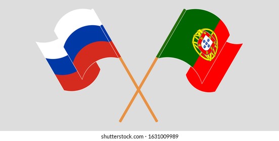 Crossed and waving flags of Portugal and Russia