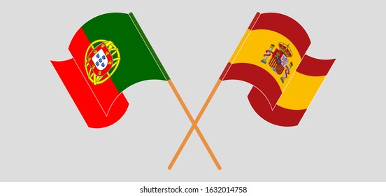 Crossed and waving flags of Portugal and Spain