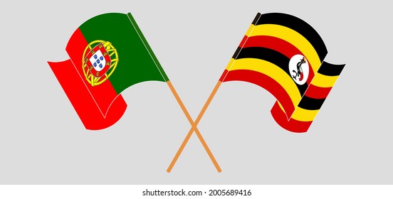 Crossed and waving flags of Portugal and Uganda