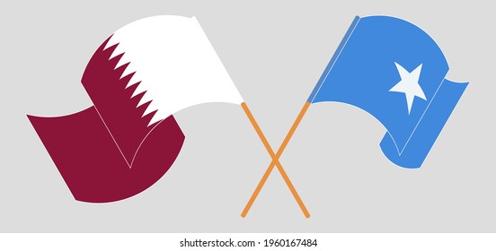 Crossed and waving flags of Qatar and Somalia