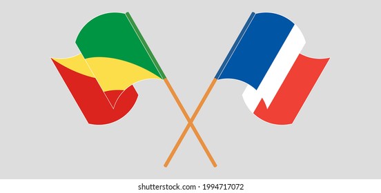 Banderas cruzadas y ondeando banderas de la República del Congo y Francia