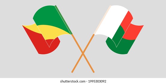 Banderas cruzadas y ondeando banderas de la República del Congo y Madagascar