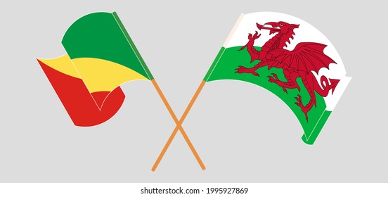 Banderas cruzadas y ondeando banderas de la República del Congo y Gales
