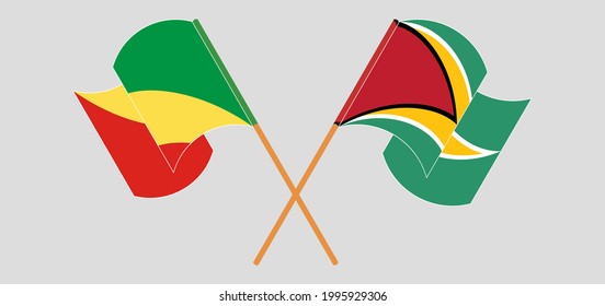 Crossed and waving flags of Republic of the Congo and Guyana