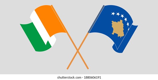 Crossed and waving flags of Republic of Ivory Coast and Kosovo