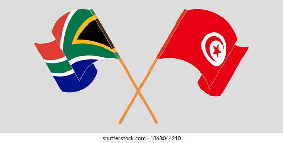 Crossed and waving flags of Republic of South Africa and Tunisia