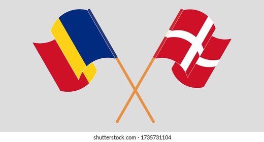 Crossed and waving flags of Romania and Denmark