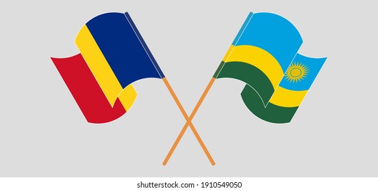 Crossed and waving flags of Romania and Rwanda