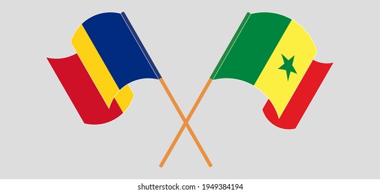 Crossed and waving flags of Romania and Senegal