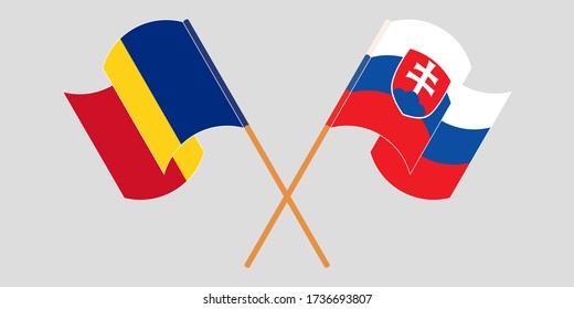 Crossed and waving flags of Romania and Slovakia