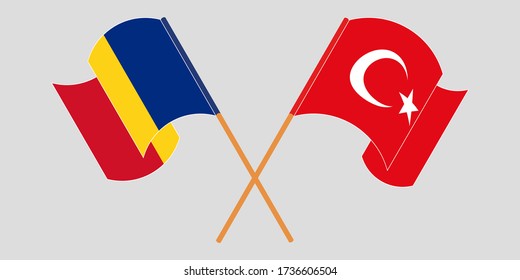 Crossed and waving flags of Romania and Turkey