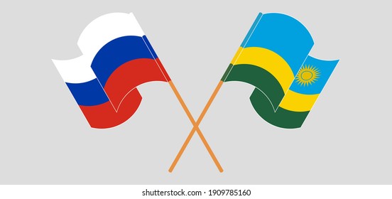 Crossed and waving flags of Russia and Rwanda