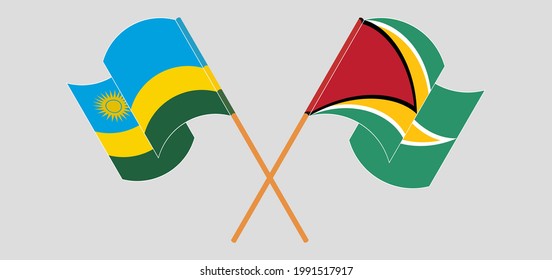 Crossed and waving flags of Rwanda and Guyana