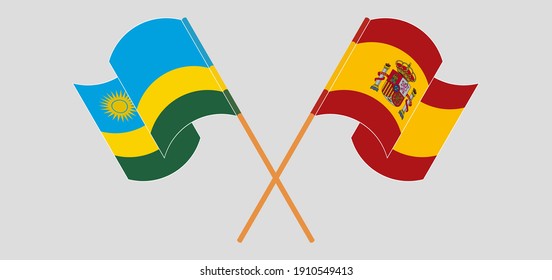 Crossed and waving flags of Rwanda and Spain