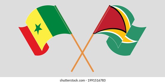 Crossed and waving flags of Senegal and Guyana