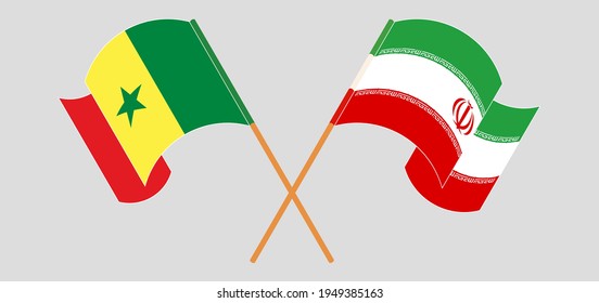 Gekreuzte und wehende Flaggen von Senegal und Iran