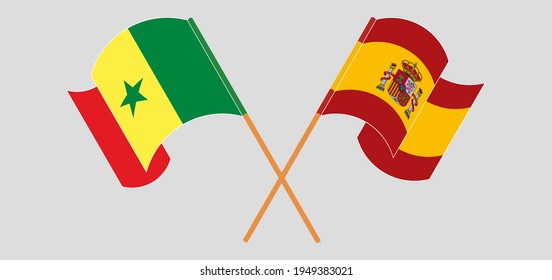 Crossed and waving flags of Senegal and Spain