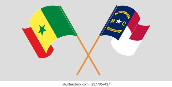 Crossed and waving flags of Senegal and The State of North Carolina. Vector illustration
