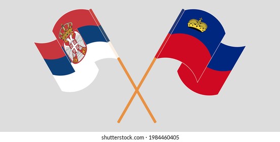 Crossed and waving flags of Serbia and Liechtenstein