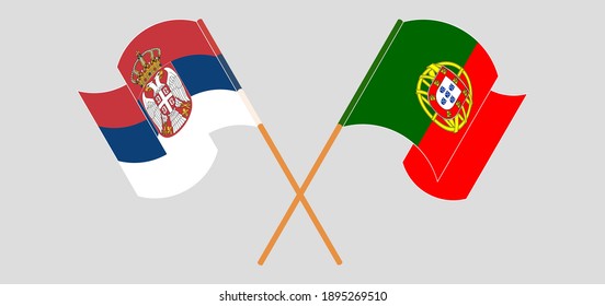 Crossed and waving flags of Serbia and Portugal

