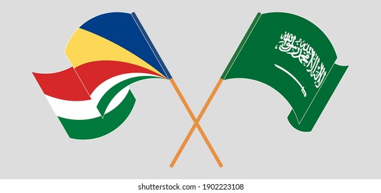 Crossed and waving flags of Seychelles and the Kingdom of Saudi Arabia