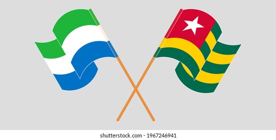 Crossed and waving flags of Sierra Leone and Togo