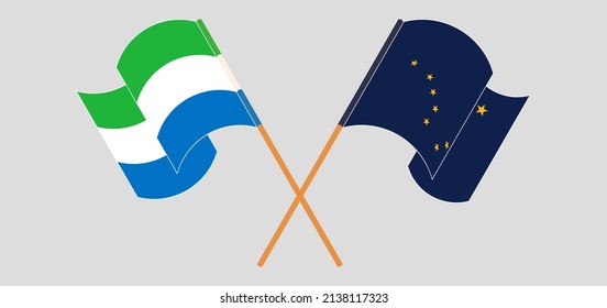 Crossed and waving flags of Sierra Leone and the State of Alaska. Vector illustration
