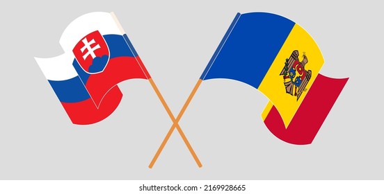 Crossed and waving flags of Slovakia and Moldova. Vector illustration
