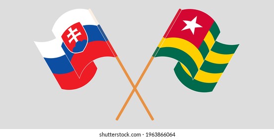 Crossed and waving flags of Slovakia and Togo