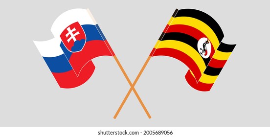 Crossed and waving flags of Slovakia and Uganda