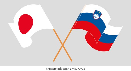Crossed and waving flags of Slovenia and Japan