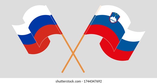 Crossed and waving flags of Slovenia and Russia