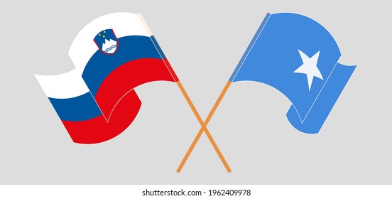 Crossed and waving flags of Slovenia and Somalia