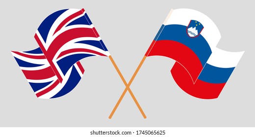 Crossed and waving flags of Slovenia and the UK
