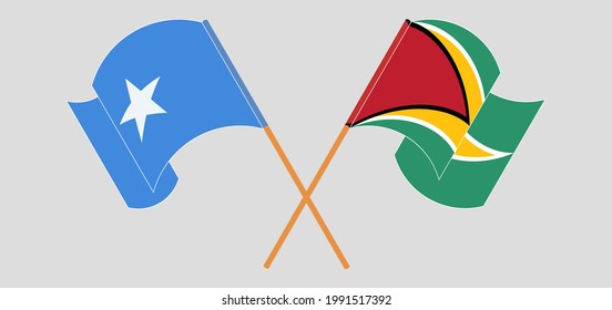 Crossed and waving flags of Somalia and Guyana